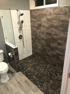 Shower with lowered fixtures