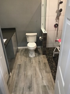 Bathroom with movable shower chair