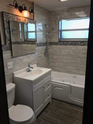 Granite tile bathroom with walk in tub